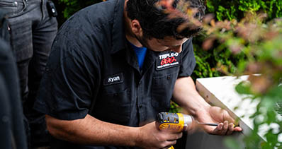 HVAC Technician Installing Air Conditioning Unit Rochester, NY